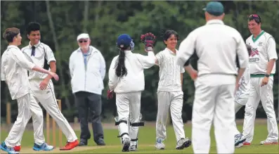  ??  ?? Faversham 2nds’ Rishi Milward-bose, 13, celebrates a wicket in the Kent Regional League game against Rodmersham 2nds and, right, Faversham line up before the match