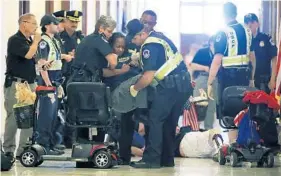  ?? MARK WILSON/GETTY IMAGES ?? Dozens of protesters, some shouting “No cuts to Medicaid,” filled the hallways outside McConnell’s office. Some required several officers to remove them, police said.