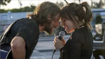  ?? Neal Preston/Warner Bros. ?? Bradley Cooper and Lady Gaga in “A Star Is Born”: The film has been nominated for a Golden Globe award for best motion picture — drama, and first-time director Cooper has been nominated for best director. Related story and major category nomination­s on C-12.