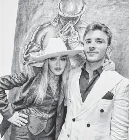  ?? RICARDO GOMES ?? Madonna and son Rocco Ritchie pose at his United States solo exhibition debut in Miami’s Design District on Wednesday night. The show is inspired by Muay Thai fighters.