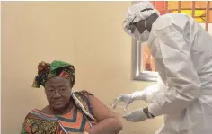  ?? — AFP ?? This file photo taken on March 10, 2015 shows a woman getting vaccinated at a health centre in Conakry during the first clinical trials of the VSV-EBOV vaccine against the Ebola virus.