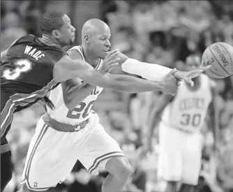  ?? By David Butler II, US Presswire ?? Within both teams’ reach: Heat guard Dwyane Wade, left, and Celtics guard Ray Allen fight for a loose ball Sunday. The roller-coaster series shifts to Miami today for Game 5.