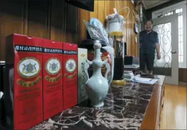  ?? AHN YOUNG-JOON — THE ASSOCIATED PRESS ?? In this photo, Ham Sung-chan, 93, watches gifts he received from his North Koran brother Ham Dong Chan during an interview at his house in Dongducheo­n, South Korea. After nearly 70years of a separation forced by a devastatin­g 195053war that killed and injured millions and cemented the division of the Korean Peninsula into North and South, Ham, 93, and his North Korean brother only got a total of 12hours together.