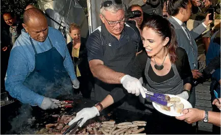  ?? PHOTO: GETTY IMAGES ?? Prime Minister Jacinda Ardern and Labour deputy leader Kelvin Davis help cook breakfast following the Waitangi Day dawn service.