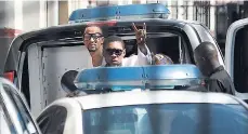  ?? FILE ?? Vybz Kartel makes a sign as he enters the Home Circuit Court on Thursday, April 3, 2014, for sentencing.
