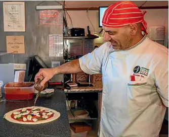  ?? BROOK SABIN/STUFF ?? Naples’ loss is Wellington’s gain: Pizza Pomodoro’s Massimo Tolve makes great pizza and loves his customers.