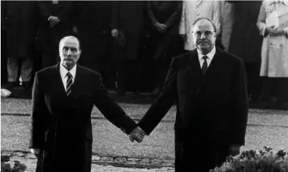  ?? ?? Then French president François Mitterrand and then German chancellor Helmut Kohl during a visit to Verdun in 1984. Photograph: Reuters