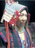  ??  ?? Sotu Mopoku, wife of Sajae, dons Akha costume. She always performs a welcoming ceremony called riak kwan for visitors. She ties white threads on our wrists and gave us khai daeng, or a red hardboiled egg, as a gesture for good health.