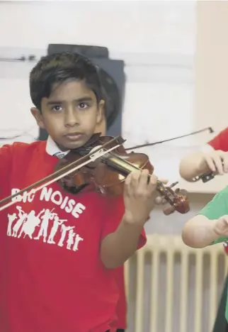  ??  ?? Making a big noise: Musical tuition for children is under threat in many parts of