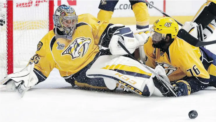  ?? — AP PHOTO ?? Predators goalie Pekka Rinne and defenceman P.K. Subban team up to stop a shot by the Pittsburgh Penguins in Game 3 of the Stanley Cup finals on Saturday.