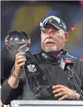  ?? BEN LIEBENBERG, AP ?? Buccaneers coach Bruce Arians holds the Vince Lombardi trophy following Sunday’s Super Bowl 55 in Tampa, Fla.