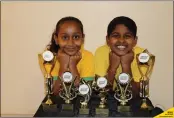  ?? Picture: Supplied ?? Maths whizzes Keshalya Singh and Dante Lazarus show off their trophies.