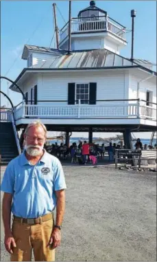  ?? BILL RETTEW JR. — FOR DIGITAL FIRST MEDIA ?? Chesapeake Bay Maritime Museum Assistant Curator Richard Scofield poses in front of a lighthouse, just one of the many spectacula­r sites in St. Michaels, Md.