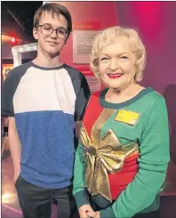  ?? 46#.*55&% 1)050 ?? At Madame Tussauds wax museum, Aden Moore got his picture taken with a wax figure of Betty White.