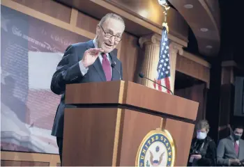  ?? J. SCOTT APPLEWHITE/AP ?? Senate Majority Leader Chuck Schumer , D-N.Y., speaks Saturday at the U.S. Capitol after the Senate approved a $1.9 trillion COVID-19 relief bill. Upon final approval by the House, the measure will head to President Biden’s desk.