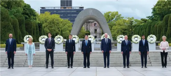  ?? ?? President Joe Biden, fourth from the right, and other G7 leaders pose for a photo during a visit to the Hiroshima Peace Memorial Park in Hiroshima, Japan on Friday, May 19, 2023, during the G7 Summit. Pictured from left : President, Charles Michel, of the European Council, Prime Minister, Giorgia Meloni, of Italy, Prime Minister, Justin Trudeau, of Canada, President, Emmanuel Macron, of France, Prime Minister, Fumio Kishida, of Japan, U.S. President, Joe Biden, Chancellor, Olaf Scholz, of Germany, Prime Minister, Rishi Sunak, of the United Kingdom and President, Ursula von der Leyen, of the European Commission. Photo : AP/Susan Walsh, Pool.