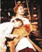  ?? Walt Disney Pictures 1957 ?? In a scene from “Old Yeller,” Tommy Kirk hugs his heroic dog while being comforted by Dorothy McGuire.