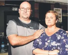  ?? Picture: ALIX SWEENEY ?? ANXIOUS WAIT: Owners of Brumby's in Fairfield Central, Lyronne and Justin Bamford, fear they may go bankrupt over the loss of the business because of flooding.