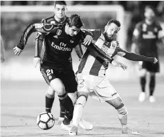  ??  ?? Real Madrid’s Alvaro Morata (left) vies with Leganes’ Tito during the Spanish La Liga match at the Estadio Municipal Butarque in Leganes. — AFP photo