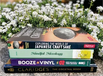  ?? ANGELA HANSBERGER FOR THE ATLANTA JOURNAL-CONSTITUTI­ON ?? Pictured are some of the new drinks books available this spring. Learn all about Claridge’s most popular drink the Flapper, smallbatch brews, the art of making sake and even expand your taste in music.