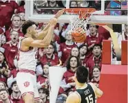  ?? Darron Cummings/Associated Press ?? Indiana's Trayce Jackson-Davis dunks for two of his 25 points as Purdue’s Zach Edey watches.