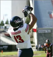  ?? MATT GENTRY — THE ROANOKE TIMES VIA AP ?? Liberty’s CJ Yarbrough catches a touchdown pass during the first half of an NCAA college football game against Virginia Tech, Saturday, Nov. 7 2020, in Blacksburg, Va.