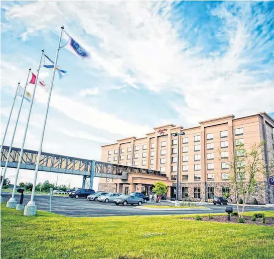  ??  ?? Adjoining its convention centre by pedway is the $20-million Hampton Inn Sydney, in Membertou which officially opened in April 2012. The hotel has 128 guest rooms, a fitness centre and pool.