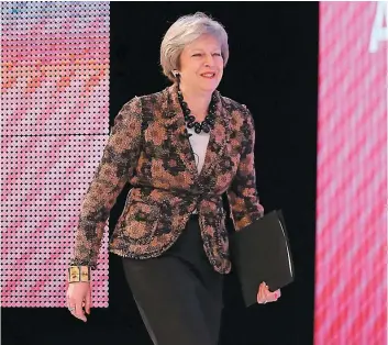  ?? PHOTO AFP ?? La première ministre Theresa May quelques instants avant de prononcer un discours à la conférence de la principale organisati­on patronale britanniqu­e, la CBI, à Londres.