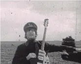  ?? ?? Rare: John Lennon holding a guitar