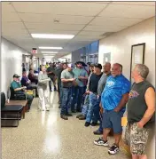  ?? Photo by Brian D. Stockman ?? Elk County Treasurer Peggy Schneider explained to those waiting that the PA Game Commission's website was experienci­ng trouble throughout the morning and afternoon.