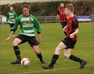  ??  ?? Paul Brennan of Gorey Rangers closes in on Jakub Konkel of Gorey Celtic.