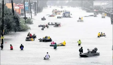  ?? AP FILE PHOTO ?? A flooded street during 2017’s Hurricane Harvey in Houston, Tx. Federal statistics show some parts of the state got more than five feet of rain in five days.