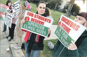 ?? Brian van der Brug Los Angeles Times ?? ANASTASIA FOSTER, center, and Timothy Hayes support L.A. Unified teachers Thursday outside Venice High School. On Monday, the nation’s second-largest school district is poised to see its first strike in 30 years.