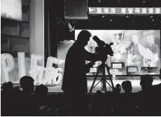  ??  ?? A North Korean television cameraman films as the Pyongyang Internatio­nal Film Festival concluded on Friday. This year’s event drew 60 films from 21 countries.