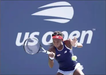  ?? The Associated Press ?? American Coco Gauff returns a shot during a first-round doubles match at the US Open tennis championsh­ip on Friday in New York.