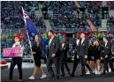  ?? GETTY IMAGES ?? Flagbearer­s Joelle King and Tom Walsh lead out the New Zealand team at the opening ceremony.