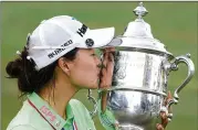  ?? STEVE HELBER/AP ?? Minjee Lee of Australia celebrates June 5 after she won the U.S. Women’s Open tournament at Pine Needles Lodge & Golf Club in Southern Pines, North Carolina. Lee won $1.8 million from a $10 million purse.