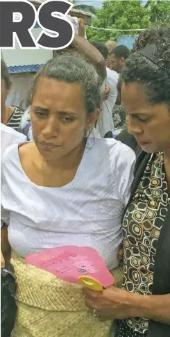  ??  ?? Jokapeci Canakaivat­a, wife of one of the deceased Lodoviko Canakaivat­a, is comforted at the funeral of her husband and the two others on January 2, 2021. Photos: Inoke Rabonu