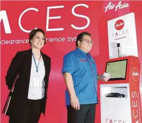  ?? PIC BY HAIRUL ANUAR RAHIM ?? Deputy Home Minister Datuk Nur Jazlan Mohamed launching AirAsia’s Fast Clearance Experience System at the Senai Internatio­nal Airport yesterday. With him is AirAsia digital, transforma­tion and corporate services deputy chief executive officer Aireen...