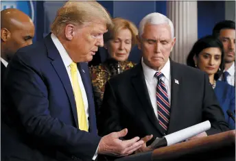  ?? PATRICK SEMANSKY — THE ASSOCIATED PRESS ?? President Donald Trump gestures for Vice President Mike Pence to speak in the briefing room of the White House on Monday about the coronaviru­s outbreak.