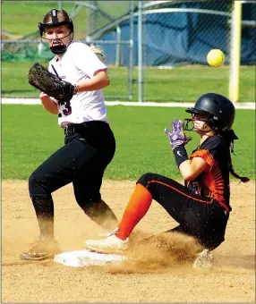  ?? Photo by Randy Moll ?? Gravette’s Gabbi Curtis slides into second as the ball is thrown past Gentry shortstop Brooke Boston during play at Gentry on April 19.