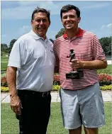  ?? CONTRIBUTE­D ?? When he came from behind to win the Players Amateur trophy last July, UGA senior Spencer Ralston (right) was excited to play with the pros this April. Now, with the tourney canceled during the pandemic, he’ll focus on becoming a pro.