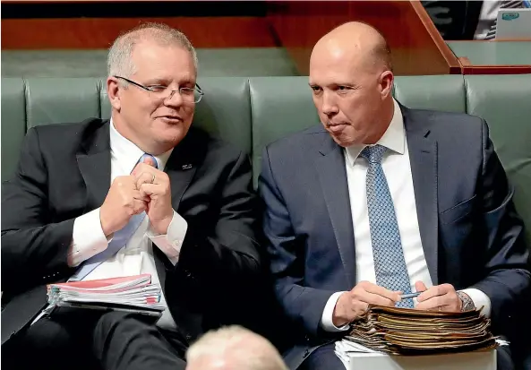  ?? FAIRFAX ?? Mates on the Liberal front bench Scott Morrison, left, and Peter Dutton are now rivals for the party leadership and role of prime minister.