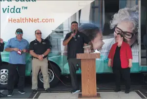  ??  ?? Pro football Hall of Famer Anthony Muñoz, second from right, gathers with Ontario Mayor Paul Leon, left, San Bernardino County Supervisor Curt Hagman and Ontario City Councilwom­an Debra DorstPorad­a to tell the public about the importance of getting vaccinated against COVID-19on Saturday.