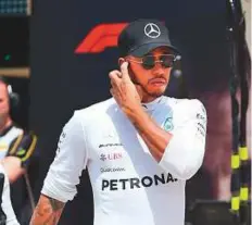  ?? AFP ?? Mercedes driver Lewis Hamilton walks in the pit lane before the Canadian Grand Prix at Circuit Gilles Villeneuve in Montreal on Sunday.