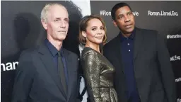  ??  ?? Director Dan Gilroy, left, actress Carmen Ejogo and actor Denzel Washington attend a special screening of “Roman J. Israel, Esq.” at the Henry R. Luce Auditorium on Monday, Nov. 20, 2017, in New York.