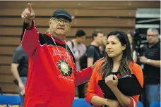  ?? LIAM RICHARDS ?? Eugene Arcand, a residentia­l school survivor, chats with teacher Kendra Weenie on Wednesday while previewing the First Nations Fitness and Wellness Academy at E.D. Feehan High School.