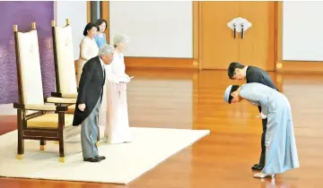  ??  ?? Akihito and Michiko receive the greetings of Crown Prince Naruhito and Crown Princess Masako as part of the ceremony marking 30th anniversar­y of Akihito’s enthroneme­nt at the Imperial Palace in Tokyo. — AFP photo