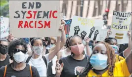  ?? Nam Y. Huh The Associated Press file ?? People demonstrat­e June 19 in Chicago to mark Juneteenth. A national coalition of labor unions, along with racial and social justice organizati­ons, plans a mass walkout from work July 20 over systemic racism and police brutality.