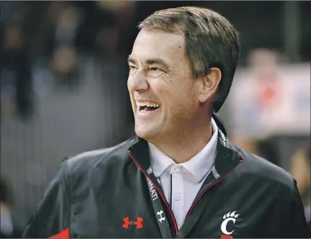  ?? Michael Hickey Getty Images ?? MIKE BOHN, athletic director of the Cincinnati Bearcats, is expected to finalize a deal shortly to assume the same position at USC. He will lead a program roiled by the college admissions scandal and a federal investigat­ion into a college basketball pay-for-play plot.